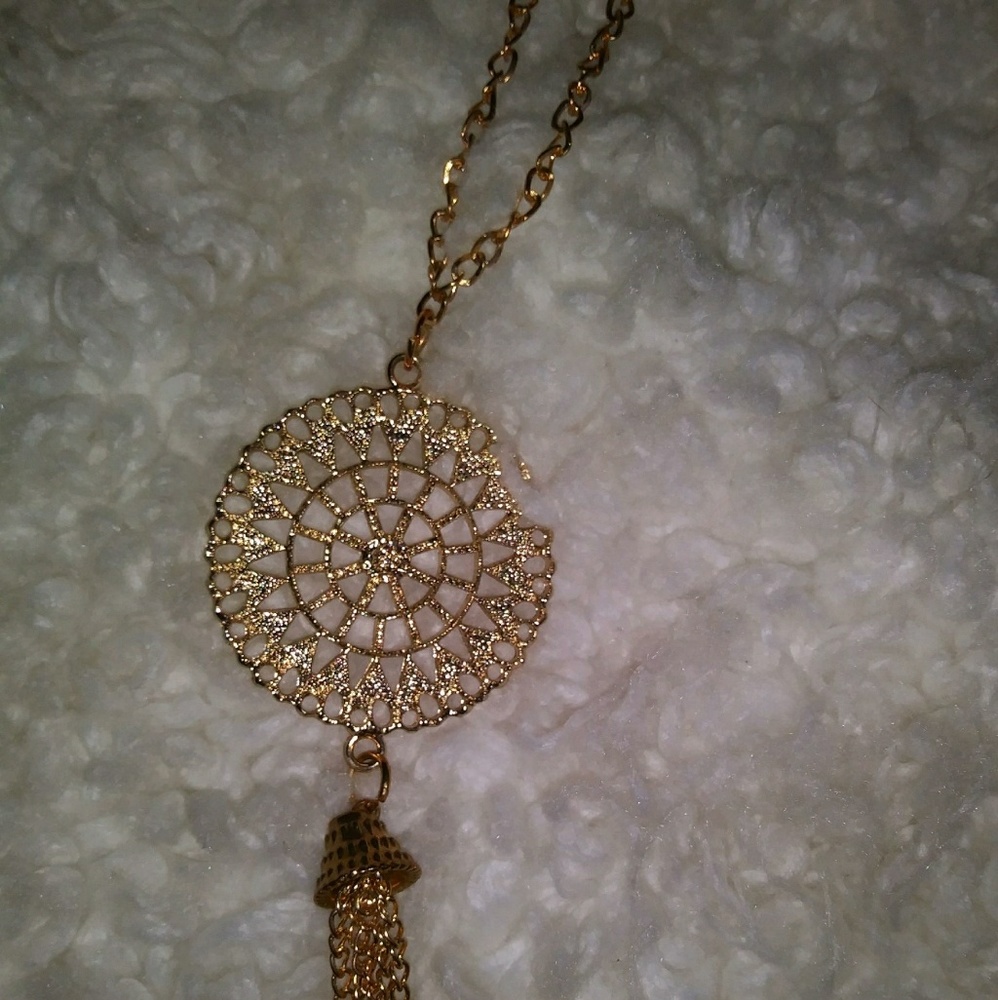 Gold mandala pendant with tassel